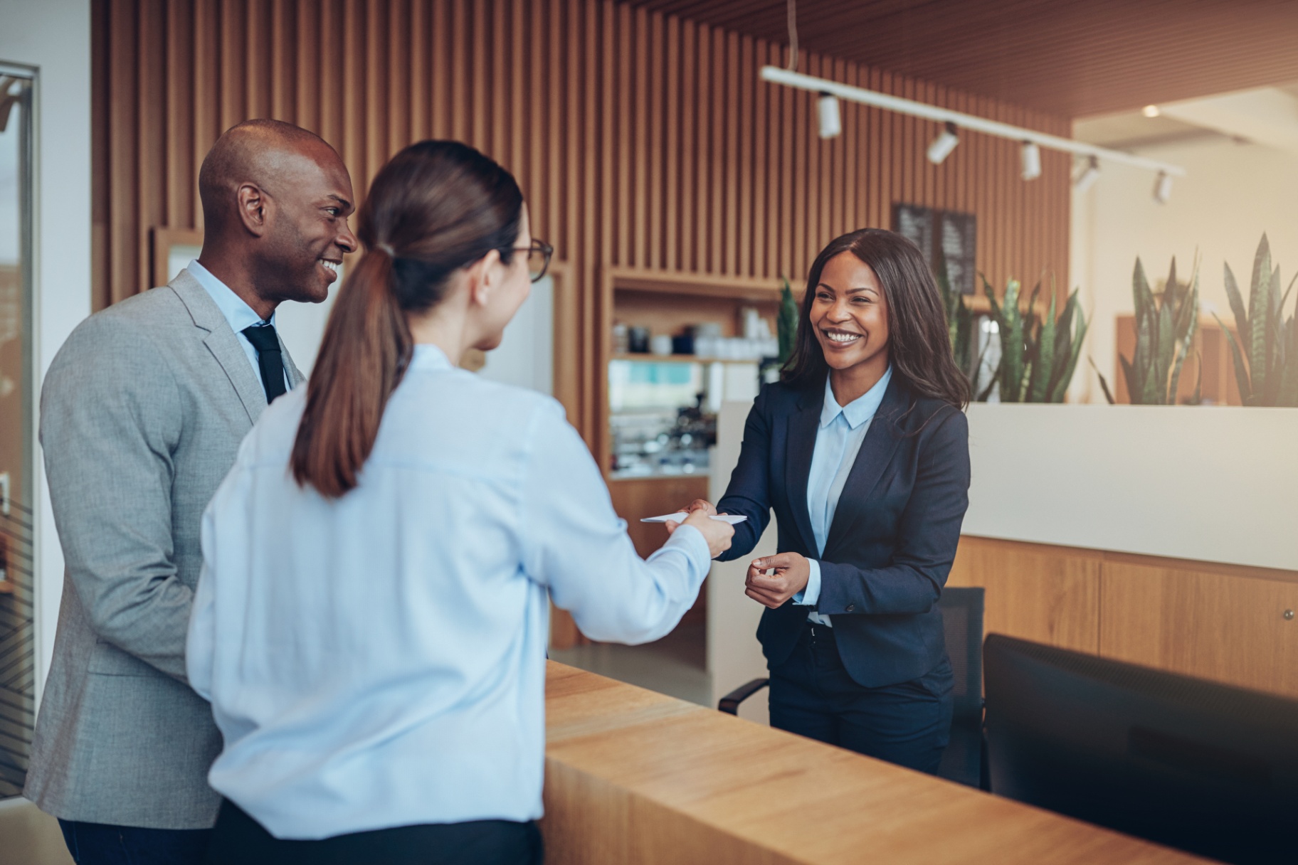 Hotel guests checking in at reception